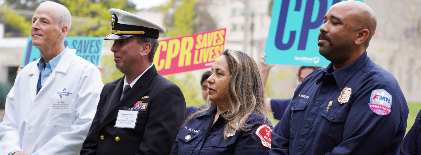 County EMS, Falck and Marine Corps EMS Medical Director standing during the Revive & Survive San Diego Press Conference.